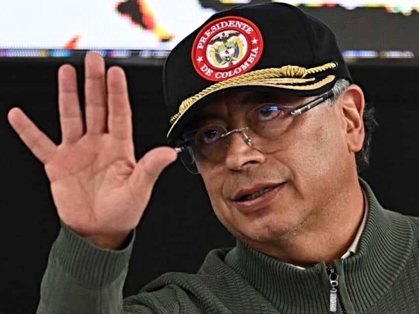 Colombia's President Gustavo Petro waves during an event with Comuneros del Sur, a disside