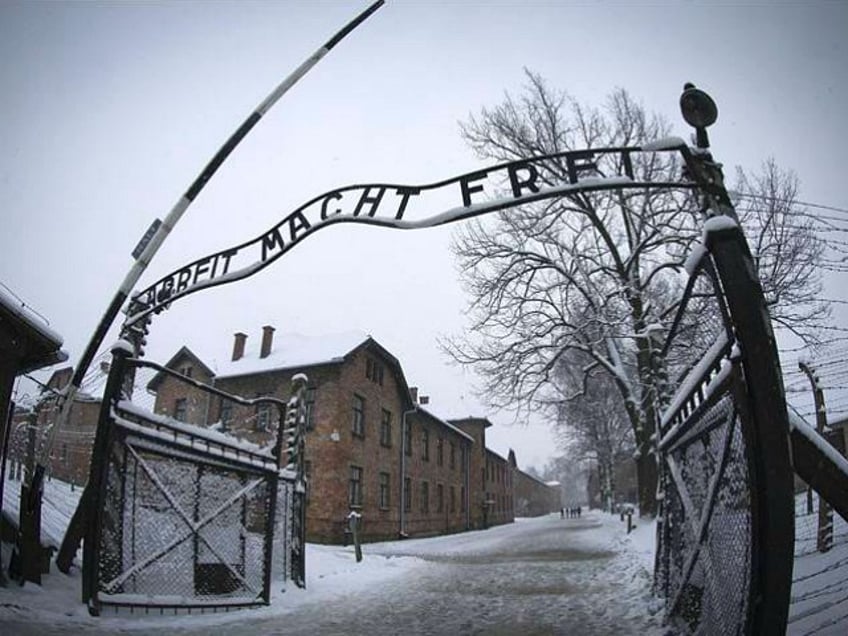 The entrance to the former Nazi concentration camp Auschwitz-Birkenau with the lettering 'Arbeit macht frei' ('Work makes you free') is pictured in Oswiecim, Poland on January 25, 2015, days before the 70th anniversary of the liberation of the camp by Russian forces. Holocaust (Photo by Joël SAGET / AFP) (Photo credit should read JOEL SAGET/AFP via Getty Images)