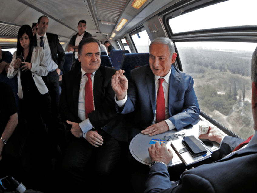 Israeli Prime Minister Benjamin Netanyahu (R) sits next to Israel's Transportation and Intelligence Minister Yisrael Katz during a test-run of the new high-speed train between Jerusalem and Tel Aviv, near Lod and Ben Gurion international Airport, on September 20, 2018. (Photo by Thomas COEX / AFP) (Photo credit should read THOMAS COEX/AFP/Getty Images)