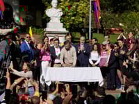 Colombia’s president signs a labor overhaul into law after 2 failed attempts