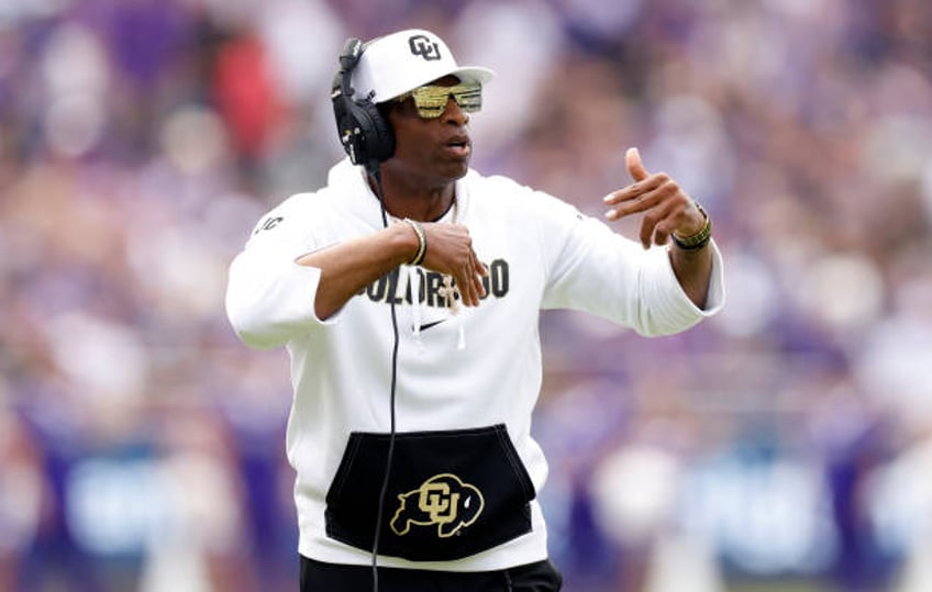 Head coach Deion Sanders of the Colorado Buffaloes calls a play against the TCU Horned Frogs during the first half at Amon G. Carter Stadium on...