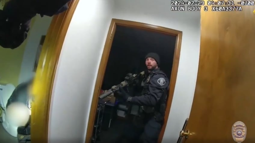 Bodycam footage of suspect sitting on toilet