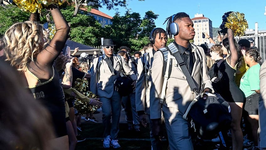 colorado football players show off custom michael strahan suits designed by deion sanders