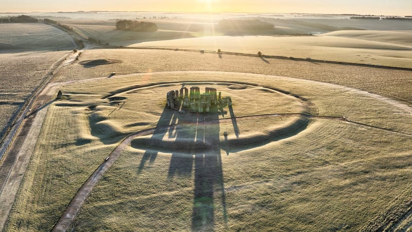 SALISBURY,ENGLAND - JANUARY 16: A view of Stonehenge at dawn with a morning frost on January 16, 2024 near Salisbury, England.