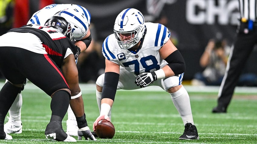 Ryan Kelly snaps the ball