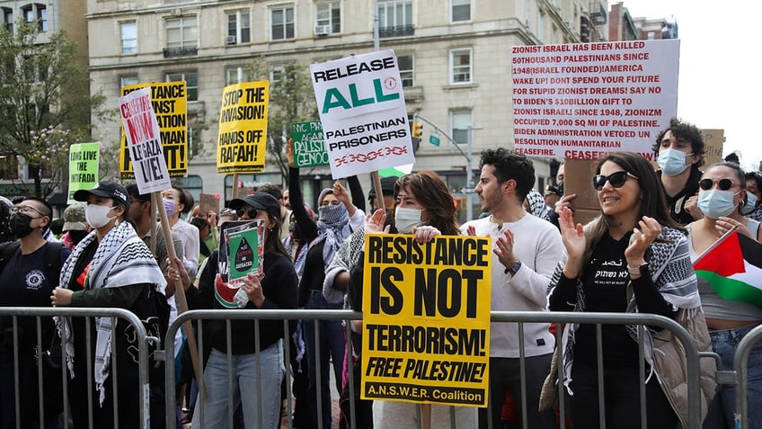 Anti-Israel protesters hold 'resistance' signs at Columbia