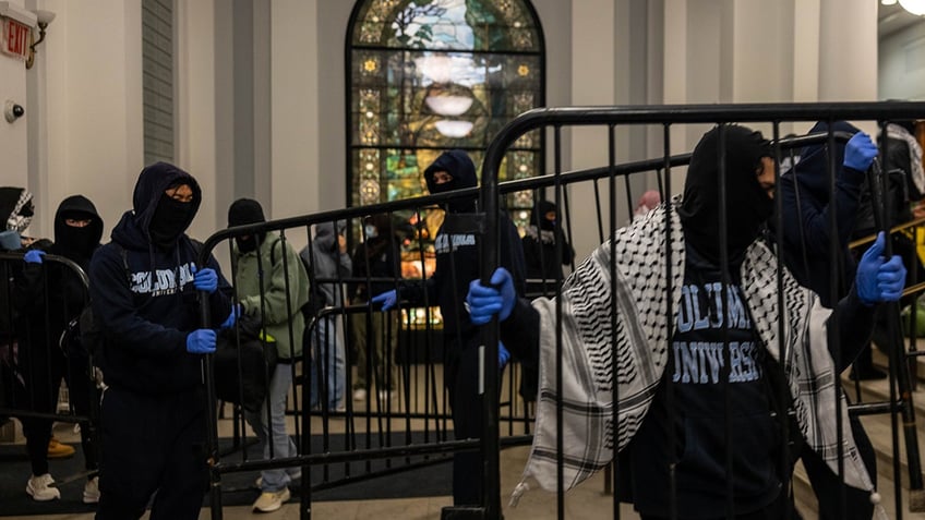 Protesters moving furniture