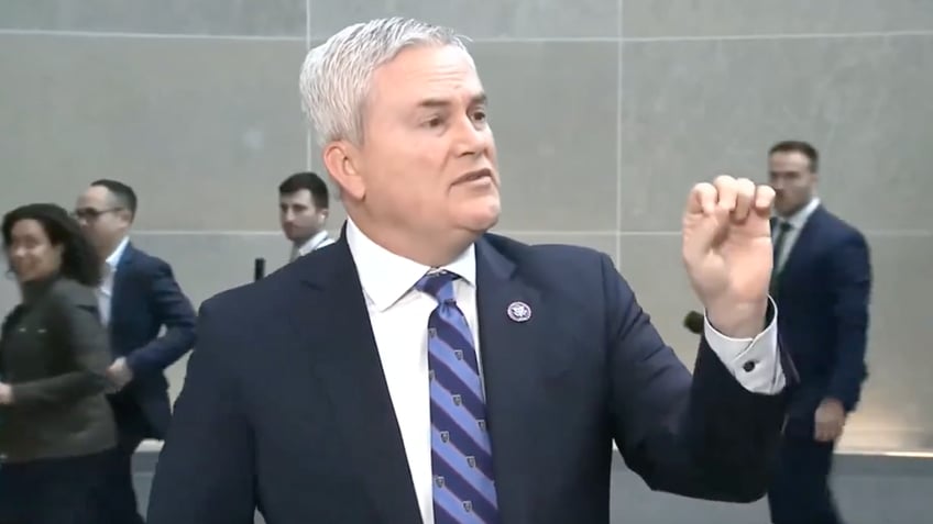 Comer talking to reporter