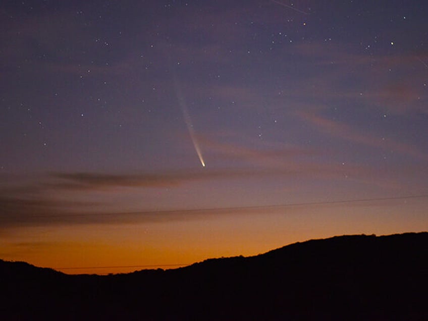 Comet C2023 A3 Tsuchinshan-Atlas is seen over the hills near the village of Aguas Blancas,