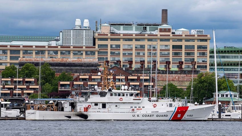 commercial fishing boat crew coast guard rescue man who fell nearly 40 feet off tanker into boston harbor