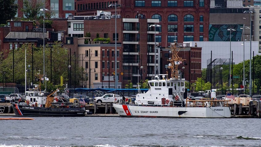 commercial fishing boat crew coast guard rescue man who fell nearly 40 feet off tanker into boston harbor