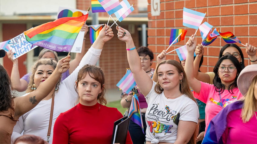 communists demand end to christian fascism at chaotic school board meeting over parental notification policy