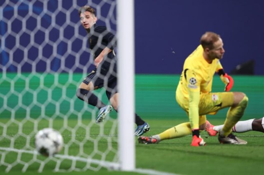 Juventus' Portuguese forward Francisco Conceicao scores against Leipzig in the Champions L