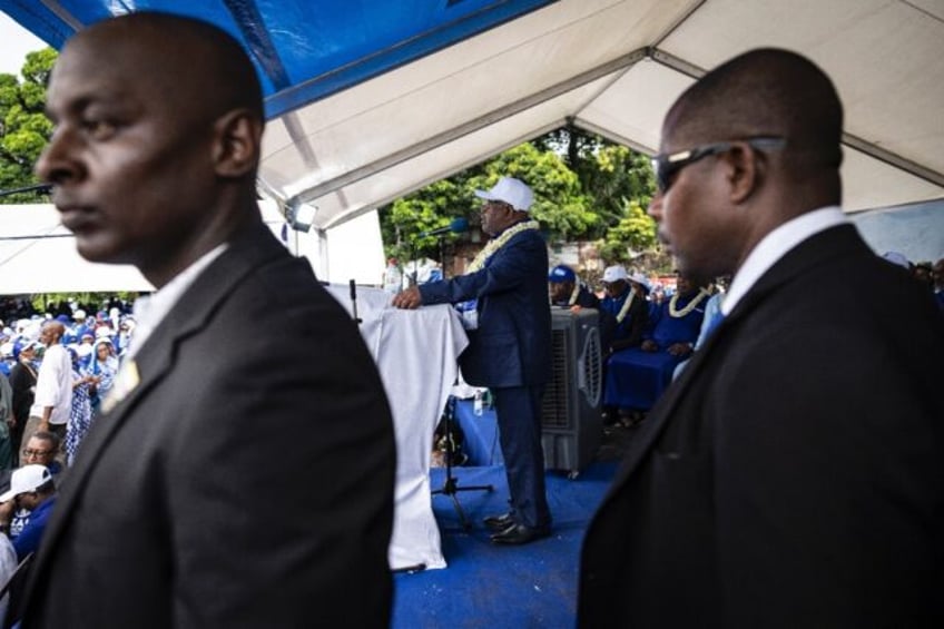 Comoros President Azali Assoumani (C) is favourite to win another term in office after Sunday's vote