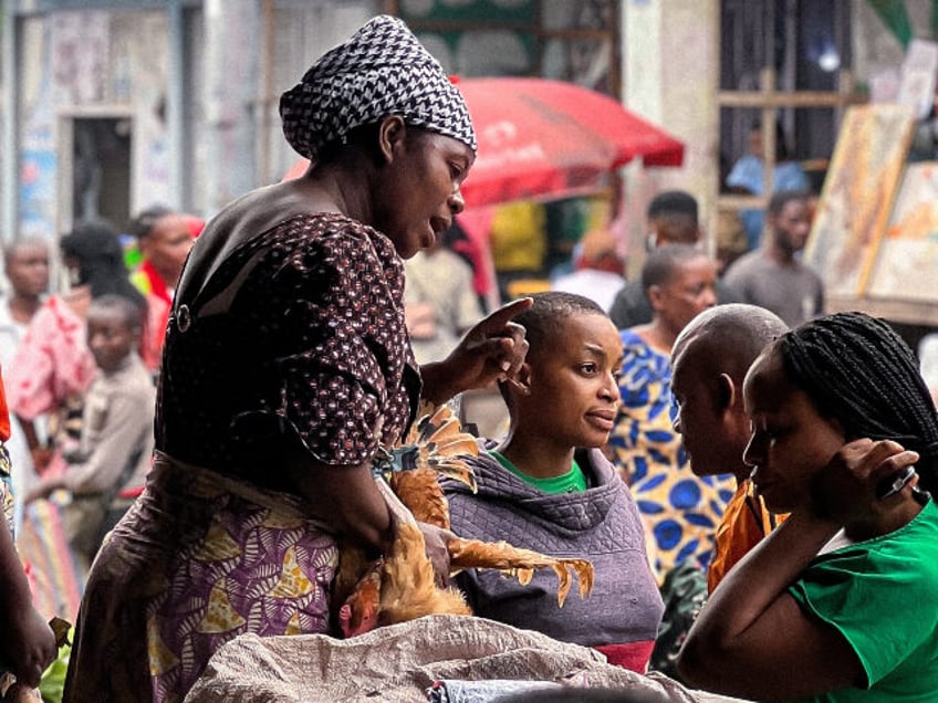 This phone taken with a mobile phone on Feb. 1, 2025 shows vendors selling chicken at a st