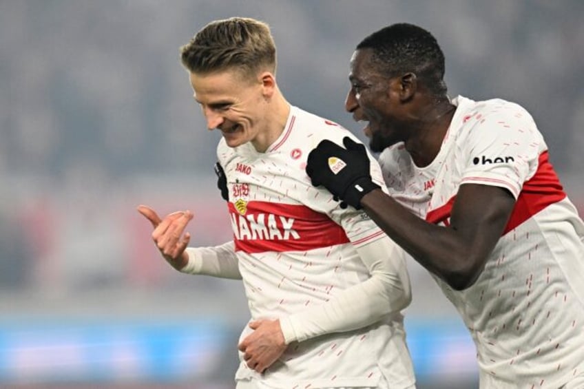 Stuttgart midfielder Chris Fuehrich (L) and forward Serhou Guirassy. Guirassy has 21 goals