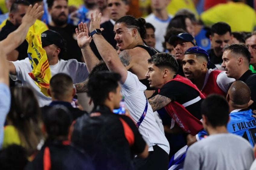 Uruguay player Darwin Nunez (center) clashes with fans at the end of Wednesday's Copa Amer