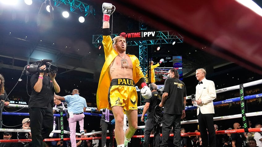 Logan Paul walks into the ring for an exhibition boxing match against Floyd Mayweather at Hard Rock Stadium, Sunday, June 6, 2021, in Miami Gardens, Fla.