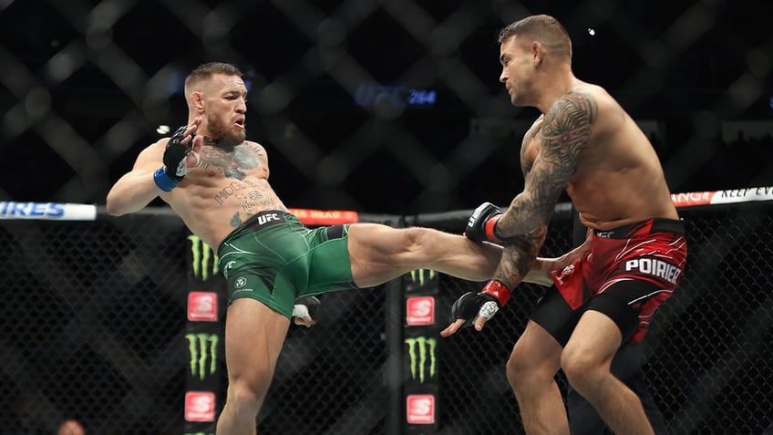 Conor McGregor kicking Dustin Poirier