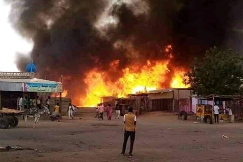 Fire rages at a livestock market in al-Fasher, the capital of Sudan's North Darfur state,