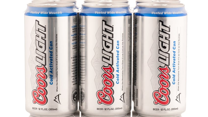 A six-pack of Coors Light cans is seen.