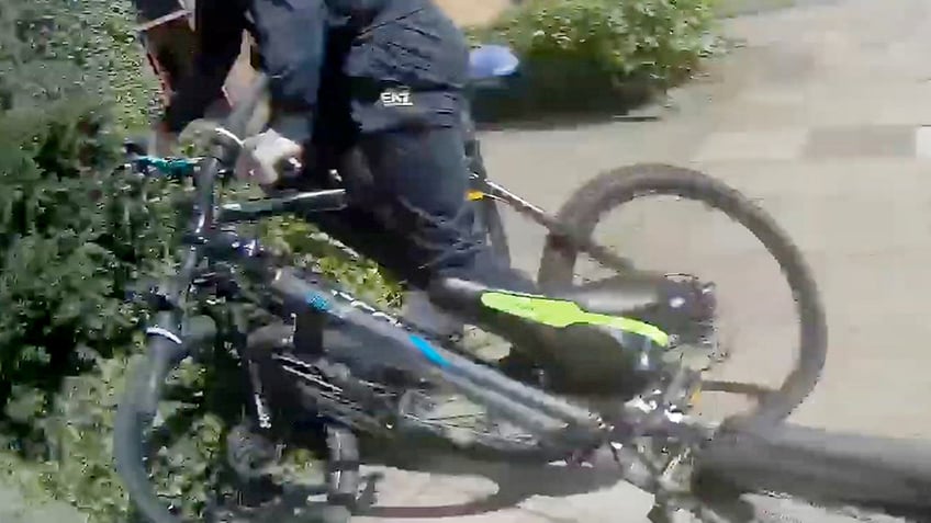 Cop getting on bike