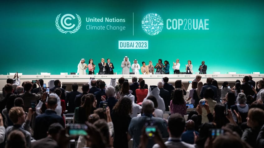 cop28 delegates clap cheer each other as beginning of the end for fossil fuels declared