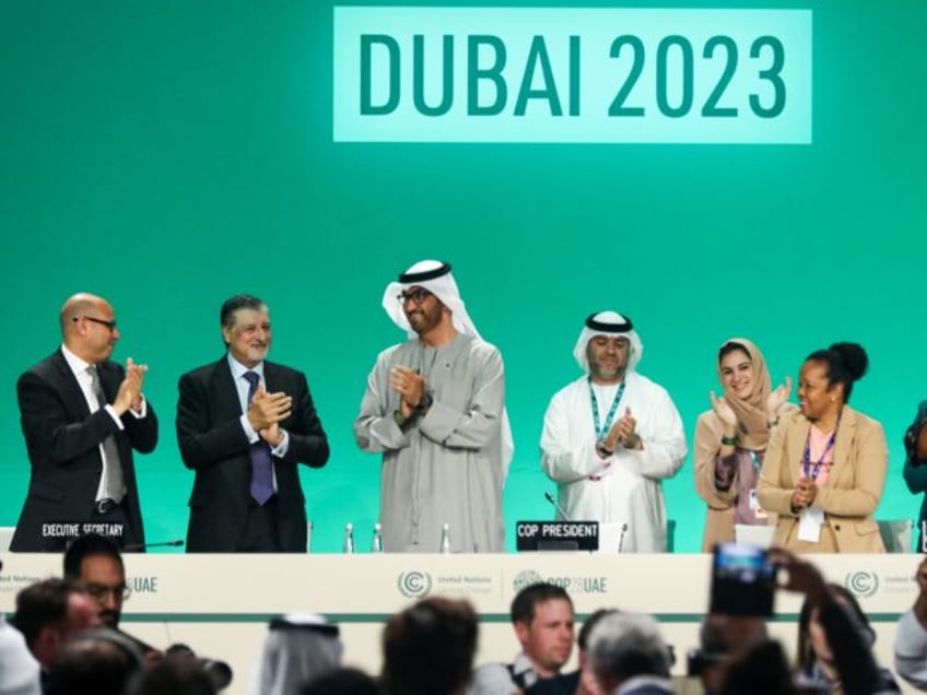 DUBAI, UNITED ARAB EMIRATES - DECEMBER 13: Delegates applaud after a speech by Sultan Ahmed Al Jaber (3L), President of the UNFCCC COP28 Climate Conference, during a plenary session on day thirteen of the UNFCCC COP28 Climate Conference on December 13, 2023 in Dubai, United Arab Emirates. The conference has …