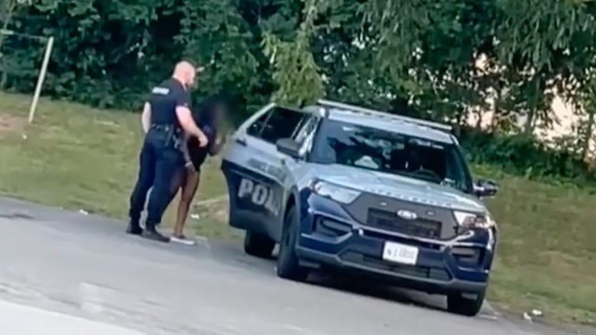 cops steamy squad car session with woman in skimpy outfit caught on video