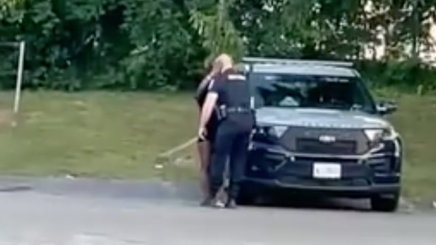 cops steamy squad car session with woman in skimpy outfit caught on video