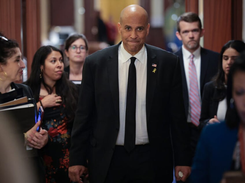 U.S. Sen. Cory Booker (D-NJ) walks toward reporters after delivering a record setting floo