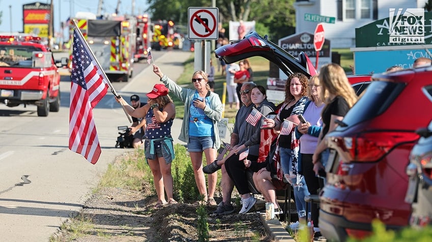 Members of the community mourn the death of Corey Comperatore on the morning of his funeral at Cabot United Methodist Church