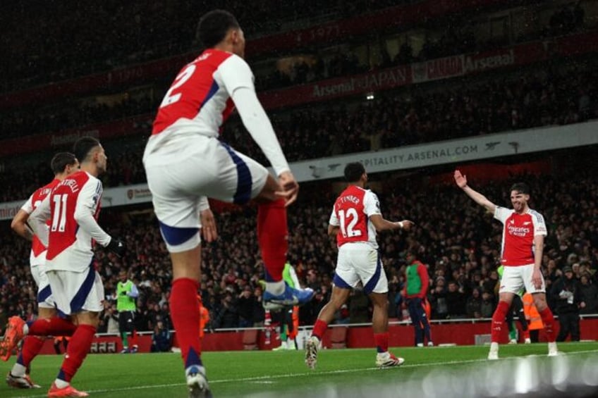 Arsenal celebrate Jurrien Timber's goal against Manchester United