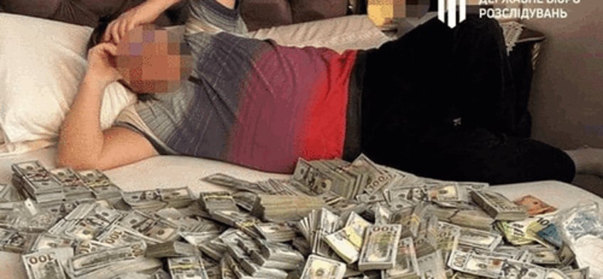 corrupt ukrainian officials son found lying in bed with huge sum of money 6 million seized from medical fraud op