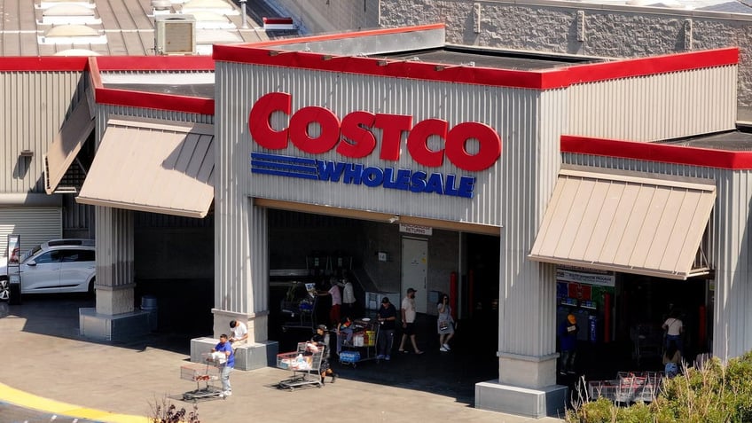 While many companies move away from DEI, Costco continues to stick to its outmoded strategy. FILE: In an aerial view, the Costco logo is displayed on the exterior of a Costco store on July 11, 2024, in Richmond, California.