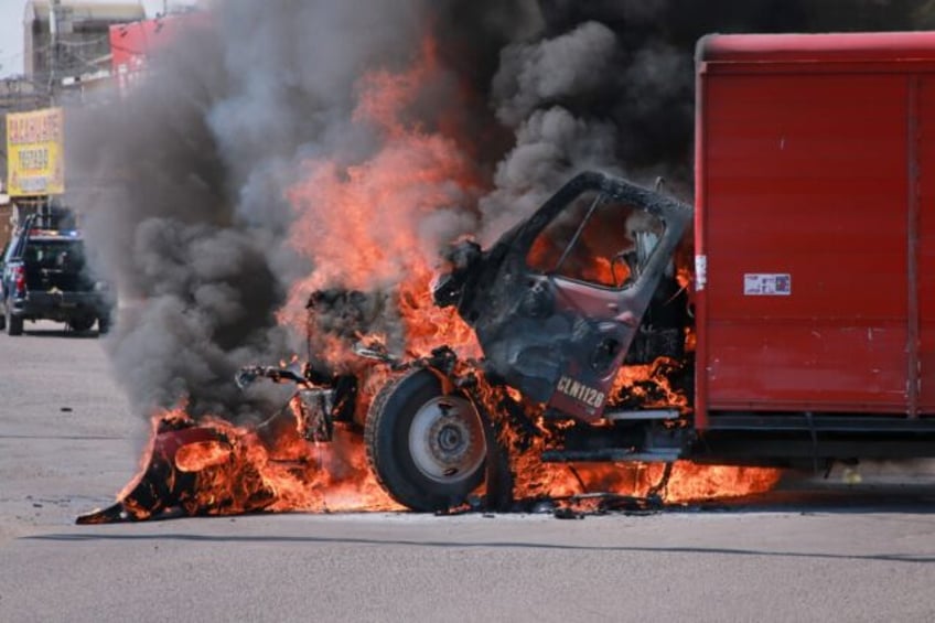 A truck burns in the Mexican cartel stronghold of Culiacan, which has been hit by gang inf