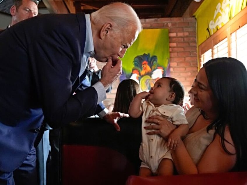 President Joe Biden greets people at a campaign event at El Portal restaurant Tuesday, Mar