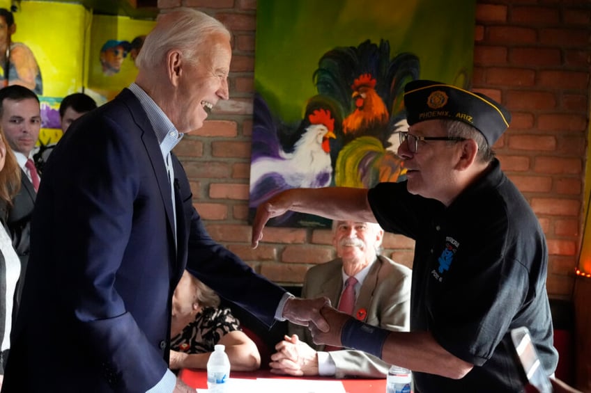 couldnt resist biden awkwardly wanders off stage to pull faces with a baby