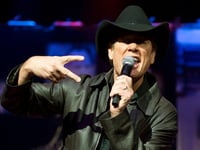 Country music singer Ronnie McDowell rushed to hospital mid-performance after slurring words