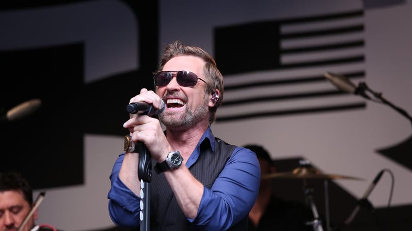 craig morgan performing in front of american flag