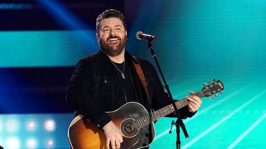 Chris Young plays guitar