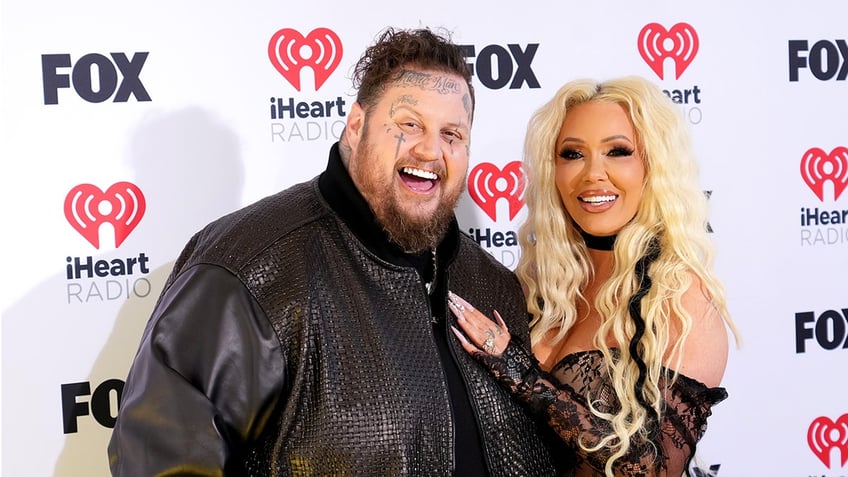 Jelly Roll and Bunnie XO attend the iHeartRadio awards presented by FOX