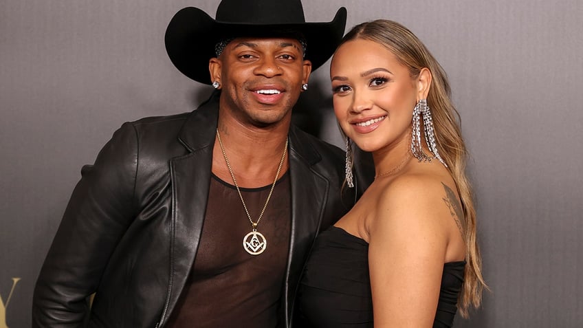 Jimmie Allen and Alexis Gale posing together