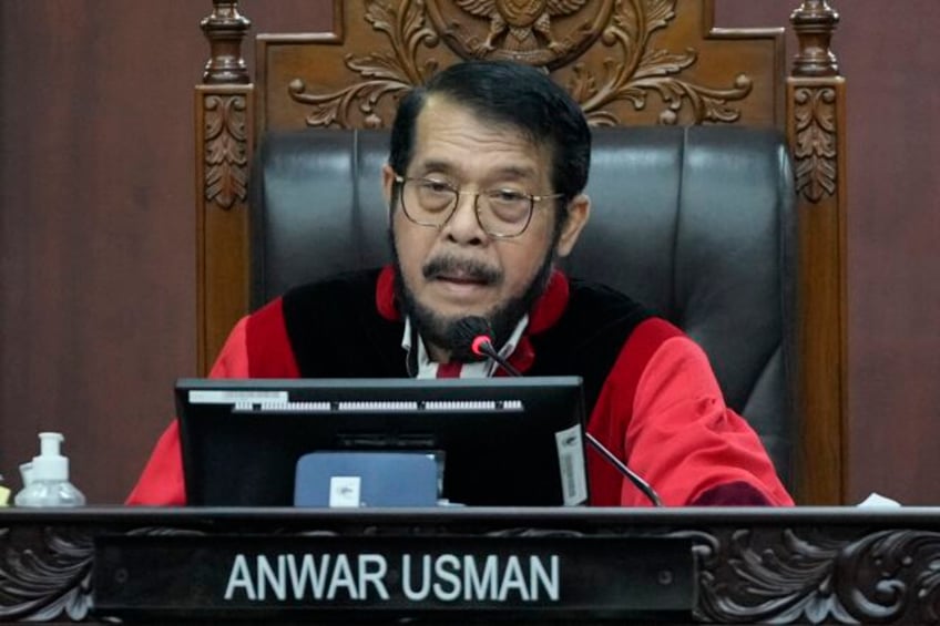 court panel removes indonesias chief justice for ethical breach that benefited presidents son