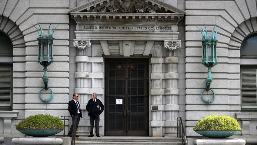 security outside door to federal courthouse