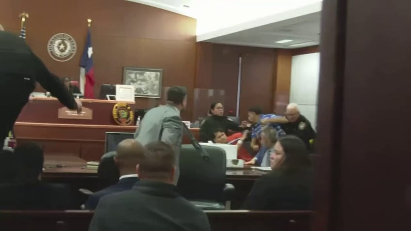 courtroom brawl breaks out in texas between murder suspect family of teen victim shot 22 times