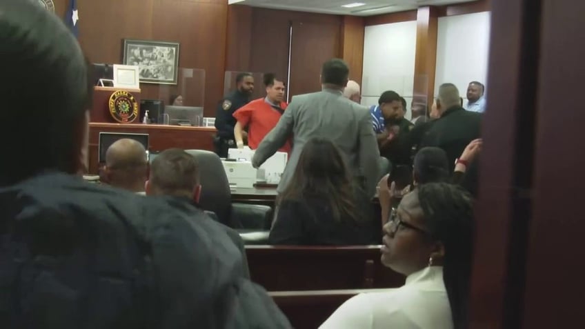 courtroom brawl breaks out in texas between murder suspect family of teen victim shot 22 times