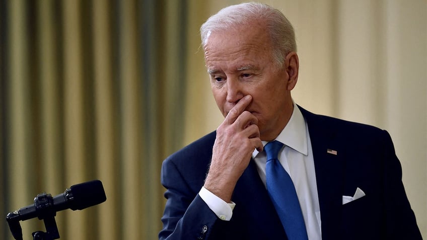 President Biden answers questions after speaking about the status of the country's fight against COVID-19 and the omicron variant, in the State Dining Room of the White House in Washington, on Dec. 21, 2021.