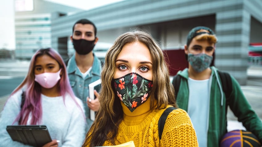 Teens in masks