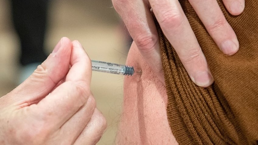 covid vaccine poll finds more than half of adults are likely to say no thanks to the vax